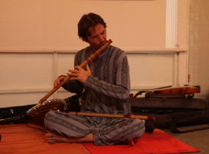 Nadaprem playing the flute