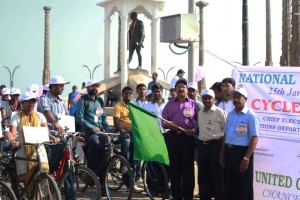 Mr. Vincent Rayer, Deputy Collector, flagging off the cycle rally